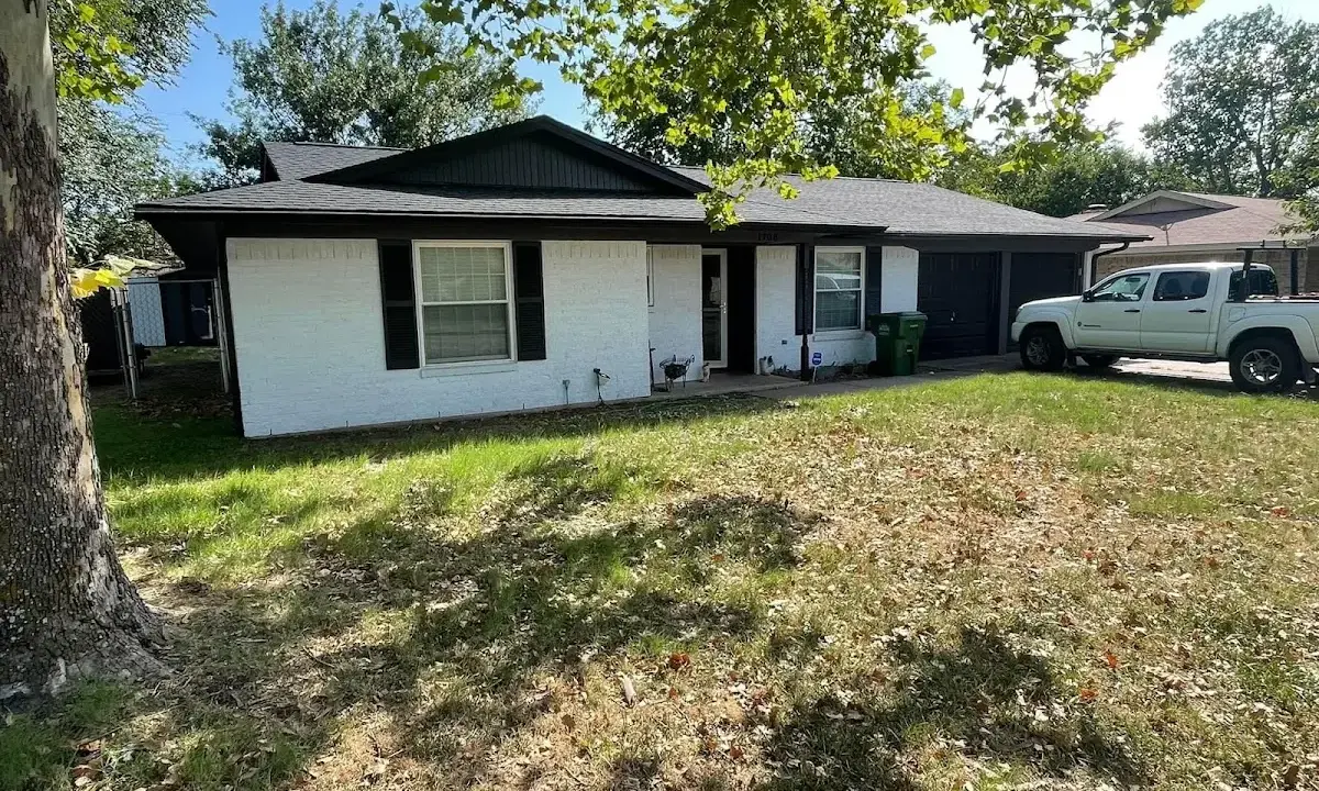 Professional roofing crew working on a residential roof in San Marino